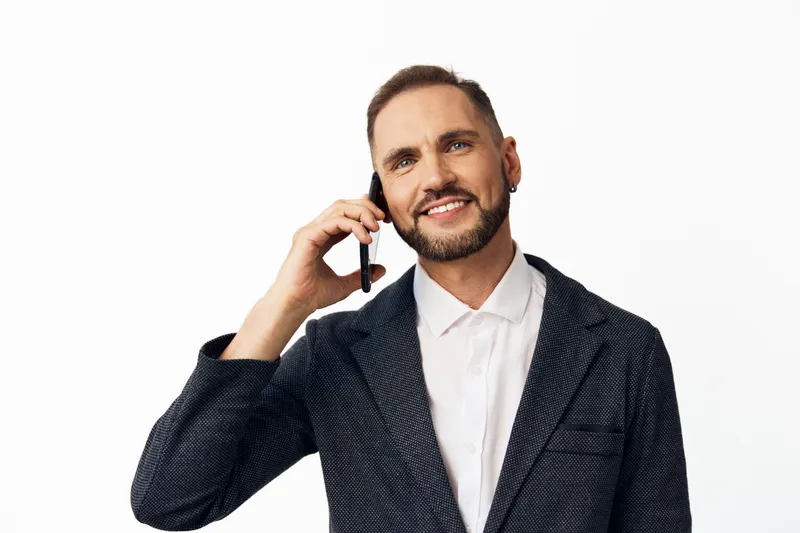 Business professional man on a colored isolated background, confident and friendly expression, suggesting leadership and clarity for corporate communication.