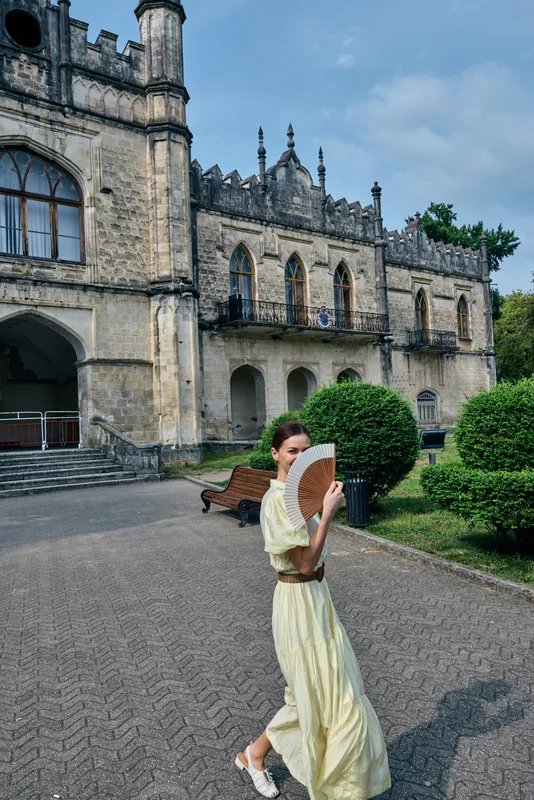 woman dress fan manor architecture garden walking, woman in yellow dress with fan summer scene by estate, authenticity inclusivity