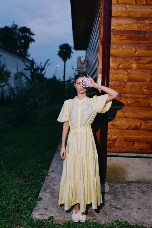 woman, dress, porch, evening, mirror, wooden, authenticity, inclusivity, woman in yellow dress by house at dusk holding round mirror, serene fashion mood