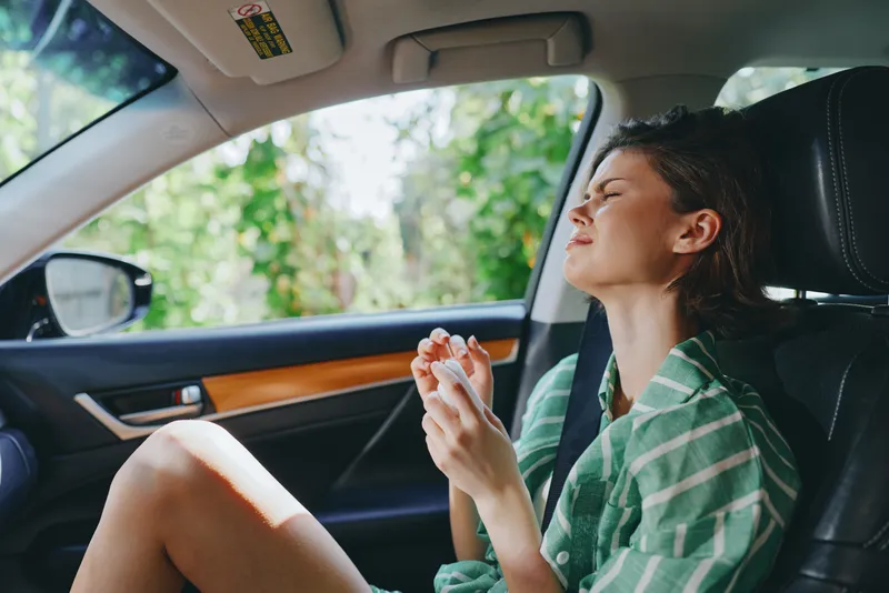 Car, driver, woman, smile a cheerful woman sits comfortably in the driver's seat with her hand confidently placed on the steering wheel, radiating joy and readiness for a journey