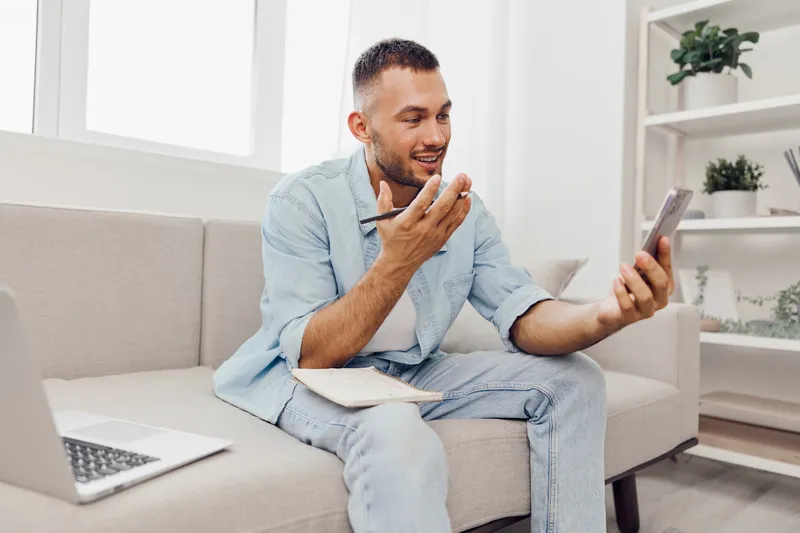 Man engaging in an emotional phone call, showcasing vulnerability and soft masculinity while embracing the theme of mental health and work-life balance.