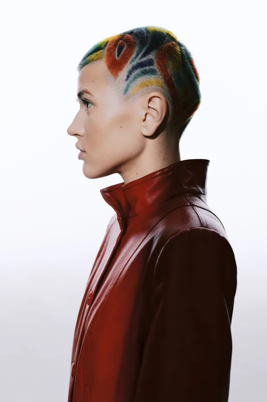woman with colorful shaved haircut wearing a high-collar red leather jacket, side profile portrait with white background, modern and bold style