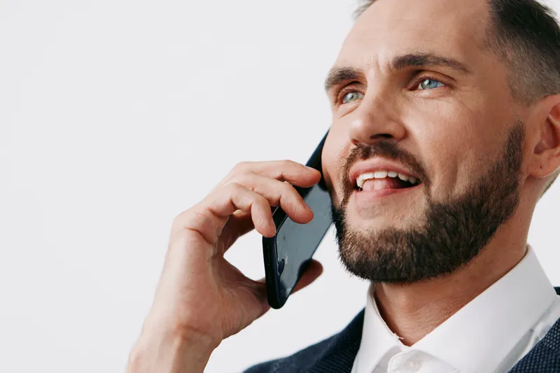 Professional business man on a call, exuding confidence and focus. Isolated color background emphasizes corporate mood, clear communication, and poised emotion for professional audiences.