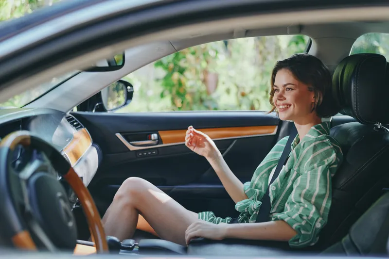 Car, driver, woman, cheerful woman sits in the driver's seat with a relaxed smile, ready for travel, confident and comfortable, showcasing everyday journey and freedom.