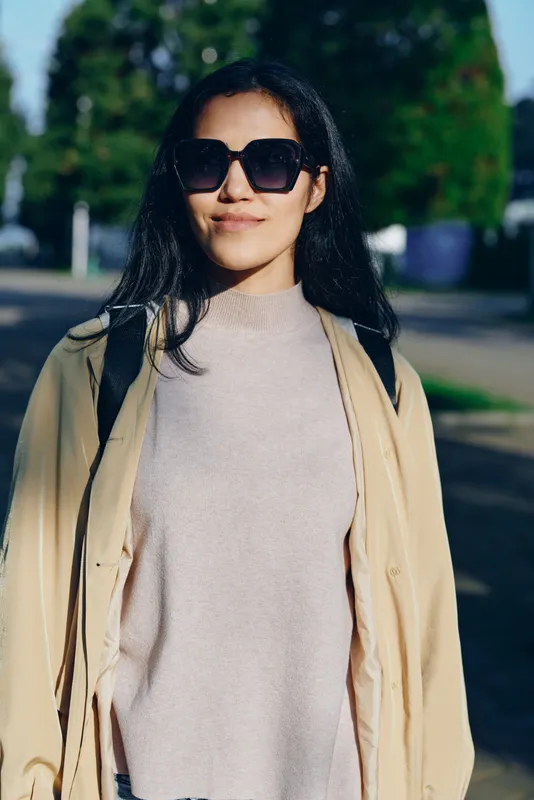 Sunglasses, woman, outdoor fashion, coat, street style, daylight, chic outfit, casual elegance, urban vibe, confident walk, modern wardrobe, seasonal trend