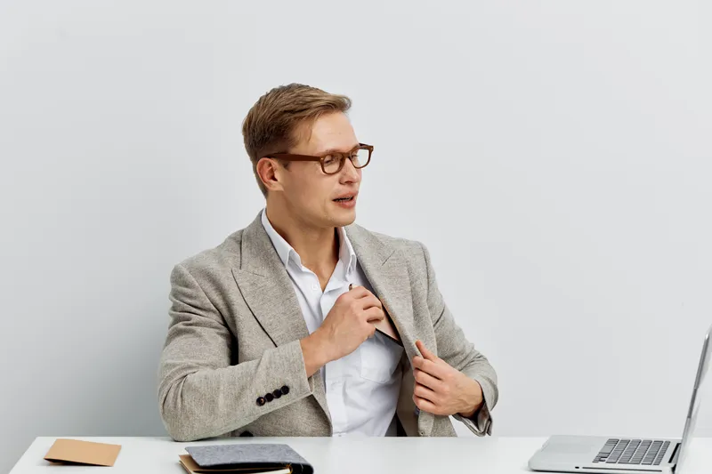 Businessman European man wearing glasses suit jacket work remotely use laptop digital nomad concept modern office interior white background