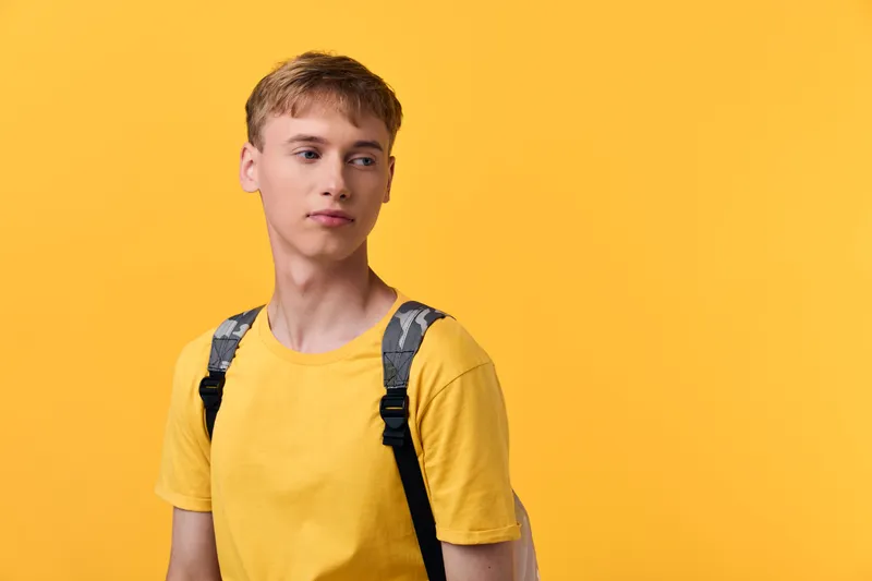 Youth, student, backpack, casual, yellow, male, fashion, everyday, urban, travel concepts in a bright scene with bold color and confident attitude for lifestyle, education and modern wardrobe