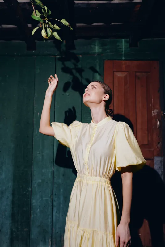 woman dress reaching fruit authenticity inclusivity