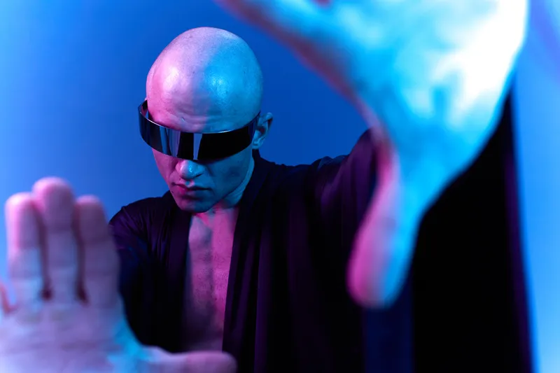 Futuristic man with sunglasses in a vibrant, colorful setting, showcasing a unique and captivating visual style. Ideal for technology and innovation themes.