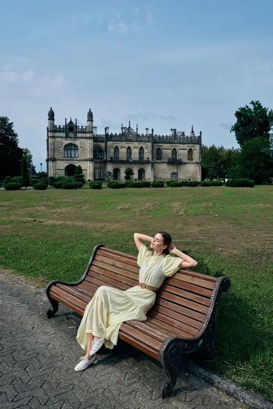 woman bench castle park relaxation fashion summer dress, relaxing pose with authentic inclusivity