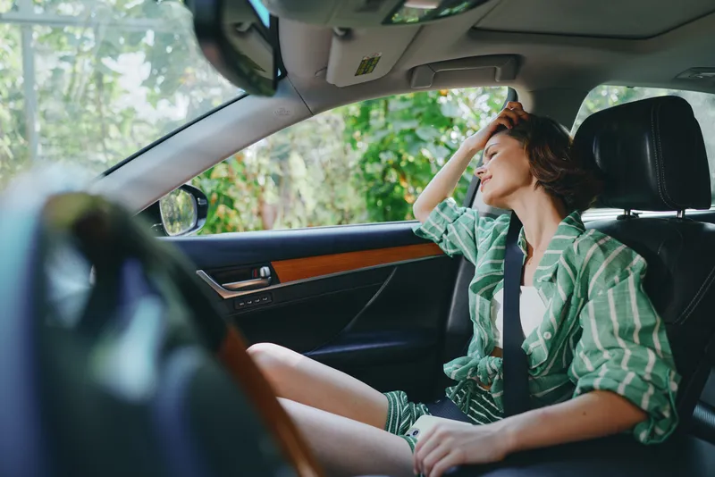 Car, driver, woman, smile a cheerful woman sits comfortably in the driver's seat with her hand confidently placed on the steering wheel, radiating joy and readiness for a journey
