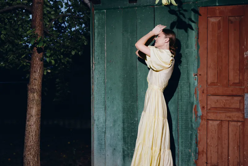 woman dress vintage sunlight outdoors wall authentic inclusive