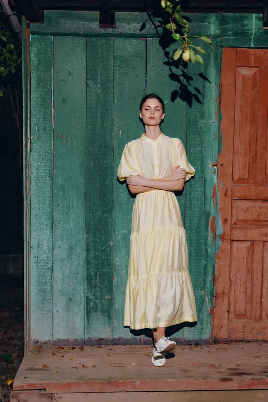 woman dress wooden door standing portrait vintage outdoor serene fashion with authenticity inclusivity natural pose