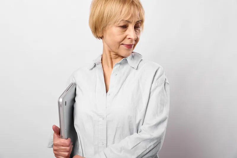 Elderly woman healthcare clinic consultation clipboard stress diagnosis care concern, holding clipboard, worried before medical check in clean white studio today