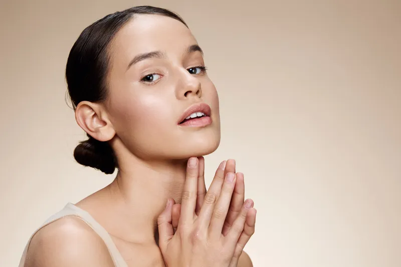 Elegant young woman with smooth skin showcasing a beauty routine concept, emphasizing natural beauty, skincare, and self care