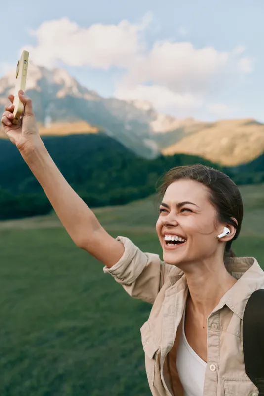 Woman lifestyle outdoor happy smiling celebration achievement nature scenery travel portrait casual clothing summer freedom joy energy upbeat cheering with banknote money in hand outdoors
