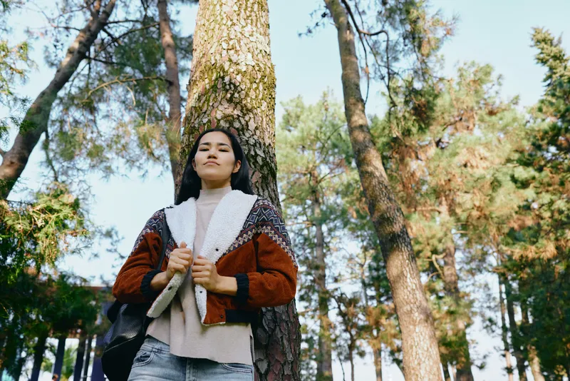 forest, trees, autumn, outdoor, woman, cardigan, nature, walk, lighting, cozy mood in forest setting with sunlight and calm breeze, candid lifestyle image for nature travel and outdoor moments
