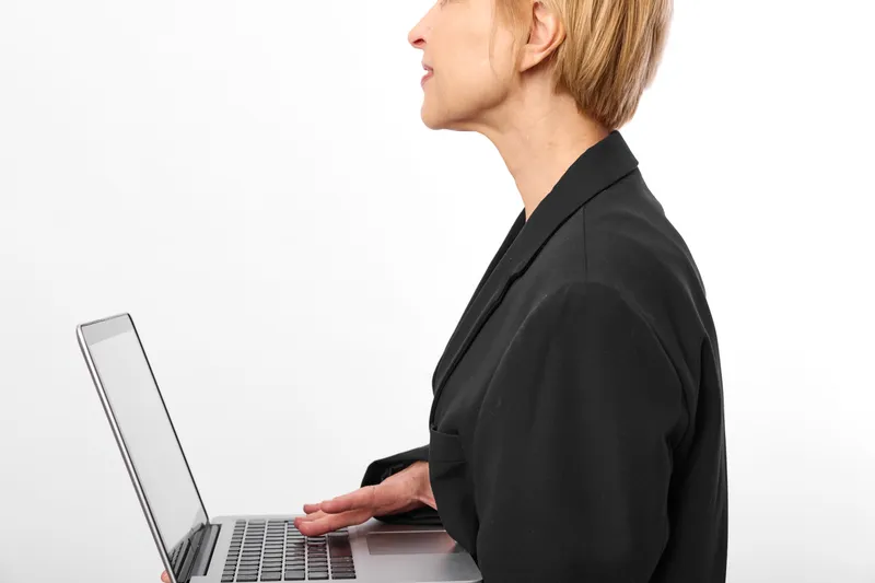 business woman laptop typing office workplace communication portrait blazer, white, isolated on white background, side view at keyboard, focused professional work today
