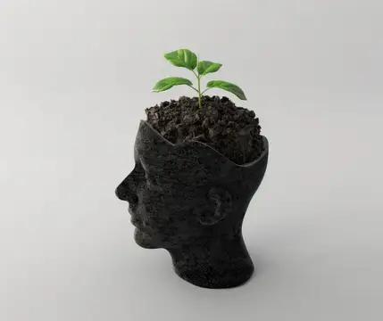 3D-рендер головы из земли с ростком вместо макушки