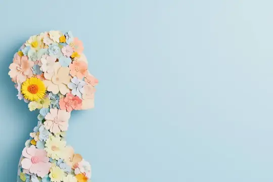 Бумажный профиль девушки из нежных цветов на голубом фоне