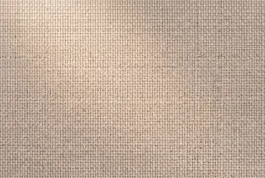 Текстура льняного полотна во весь кадр со спокойным ритмом сетки, деталями натурального волокна и нейтральными тонами для декоративного коммерческого дизайна