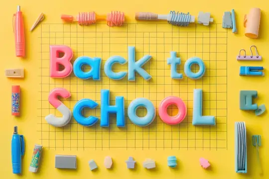 Яркая надпись Back to School из пластилина на желтом фоне с канцелярией