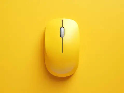 Желтая компьютерная мышь на желтом фоне