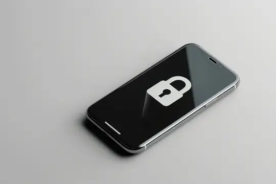 Смартфон с белым значком замка на экране