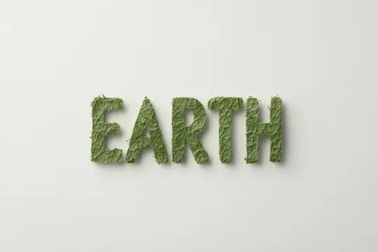 Слово EARTH, выложенное из мха на белом фоне