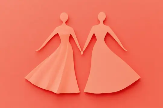 Художественные бумажные фигурки, олицетворяющие дружбу и единство, выделенные на мягком коралловом фоне