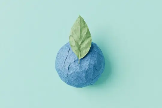 Бумажный синий шар с зеленым листом на бирюзовом фоне