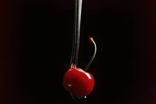 Спелая вишня с черешком на чёрном фоне