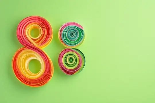 Восьмое марта из разноцветных бумажных завитков на зелёном фоне