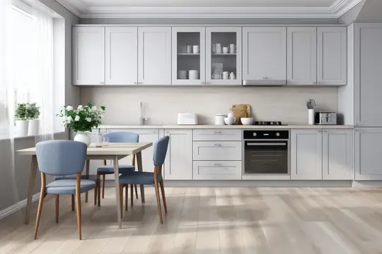 Светлая кухня с серыми шкафами и обеденным столом у окна