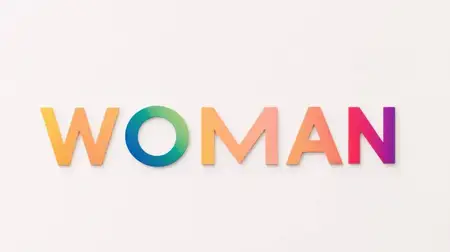 Яркий градиентный текст, читаемый как WOMAN, символизирует женственность и расширение прав и возможностей