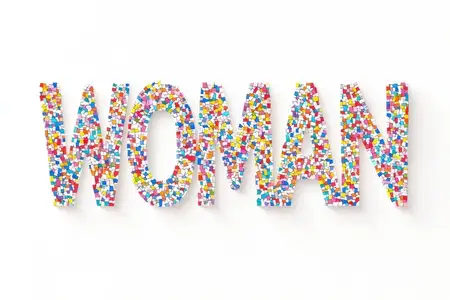 Яркое изображение слова WOMAN, составленного из разноцветных кубиков, демонстрирующее креативность и важность разнообразия в современной культуре