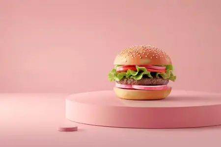 Вкусный бургер на розовом столе на фоне розового цвета для рекламы еды и красоты