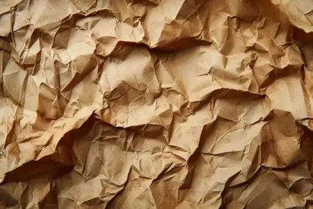 Фон из мятой коричневой бумаги для фотографии и художественных работ