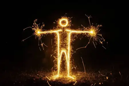 Эта светящаяся фигурка человечка, созданная из ярких искр, передает суть энергии и креативности