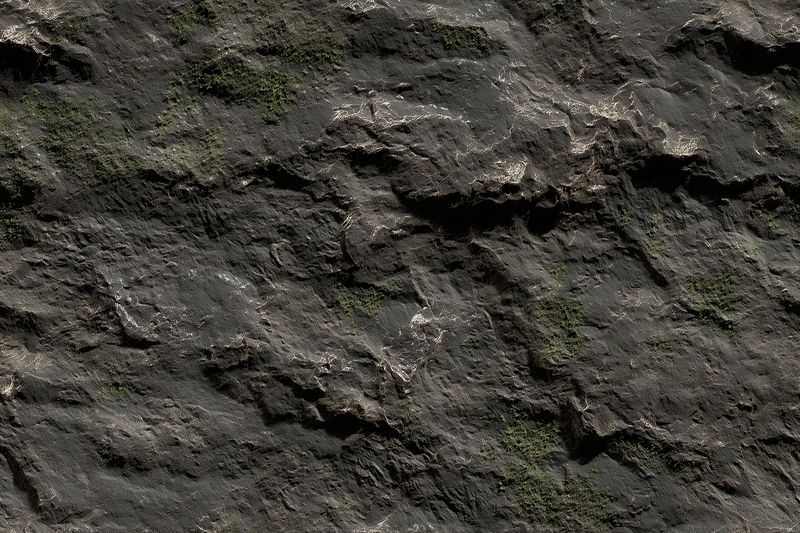 Close-up of a dark, rough rock surface with moss patches and fine gravel, showcasing rugged geological texture, weathered layers and natural mineral detail ideal for background or study.
