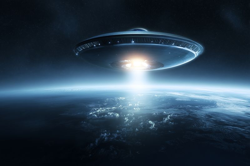 A luminous flying saucer hovers above a planet's curved horizon at night, emitting a concentrated beam of light through the thin atmosphere while distant stars and cosmic clouds shimmer in the dark.