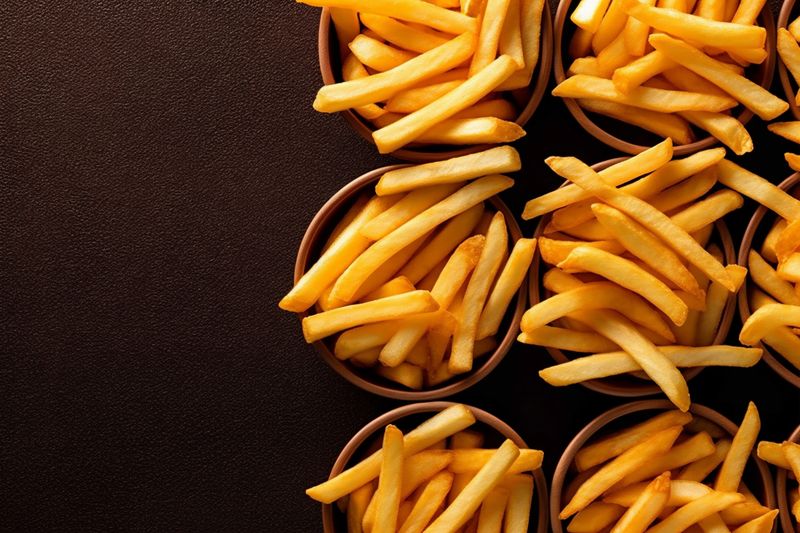 fat snack meal fry chip potato french background tasty food fast. Generative AI.