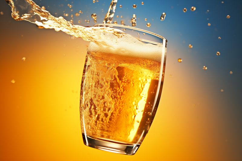 gradient drink glass bubble foam alcohol splash background yellow cold beer. Generative AI.