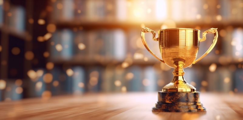 champion library gold competition bokeh celebration cup award trophy prize. Generative AI.